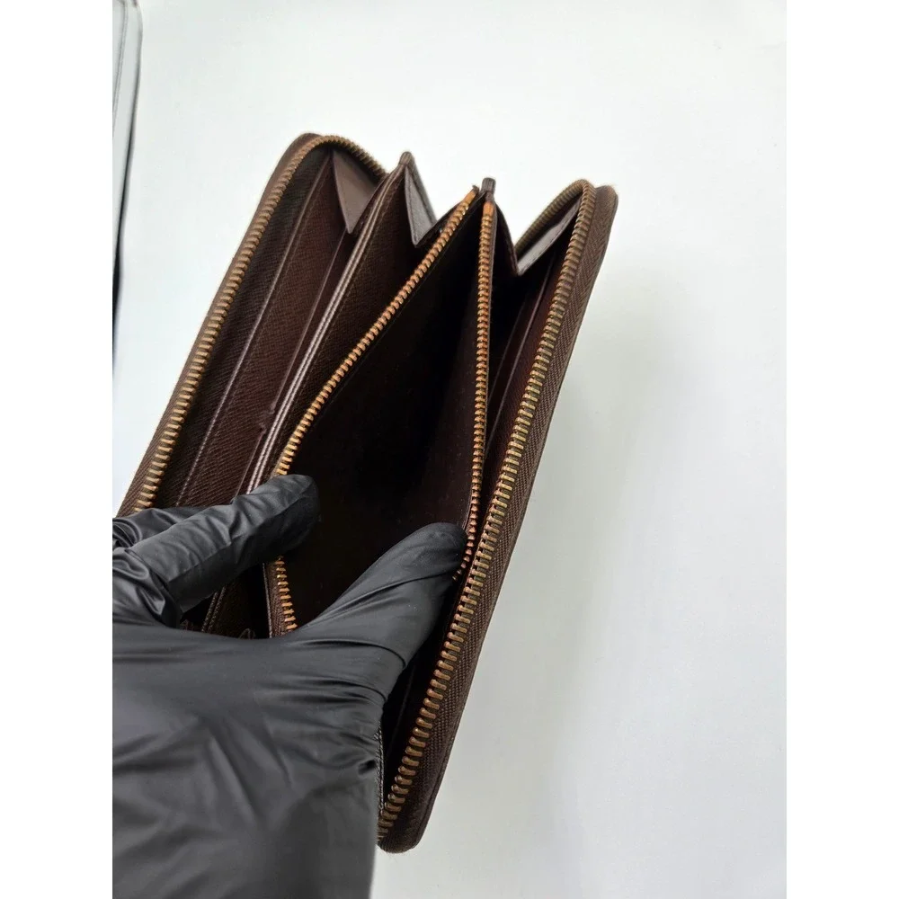 Louis Vuitton Damier Ebene Zippy Wallet Brown Coated Canvas